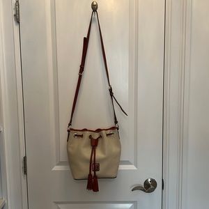 Dooney & Bourke Leather drawstring bucket crossbody bag.